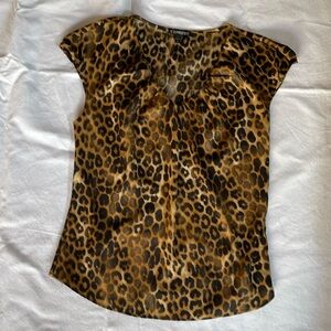 Express Leopard sleeveless blouse size SP Pre-owned but in good condition.
